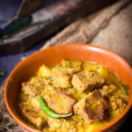 This traditional bengali recipe of  dhokar dalna is a keeper! A vegetarian recipe which is also niramish (no onion no garlic recipe) made of lentil cakes simmered in a simple tomato gravy.