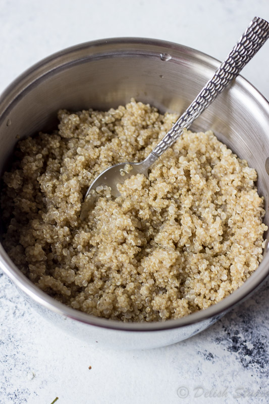 Cooked quinoa in a saucepan for making quinoa patties.