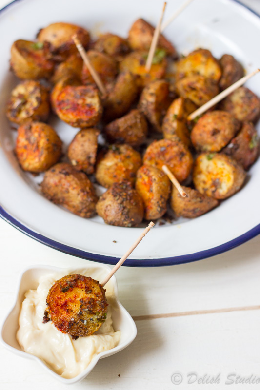 Crispy Spicy Cajun Roasted Potatoes dipped in mayonnaise
