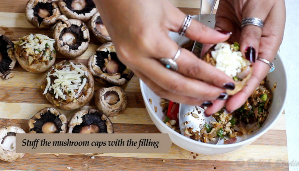Stuffing with cheese and filling to make baked cheese stuffed mushrooms