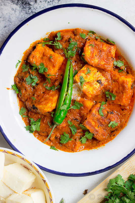 Keto paneer makhani garnished with green chillies and coriander.