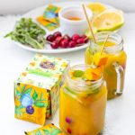 Aam Salaam mango iced tea mocktail side view of ingredients and drinks in 2 mason jars